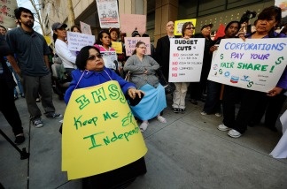 Lillibeth Navarro, executive director and founder of Communities Actively Living Independent & Free, takes part in a rally against proposed budget cuts in front of Gov. Jerry Brown's office on Jan. 10, 2011 in Los Angeles. The rally included several union and community activist groups representing the disabled.