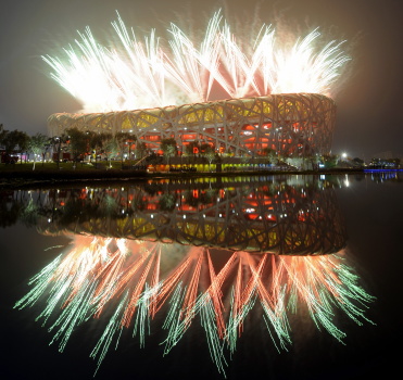Fireworks explode next to the National S