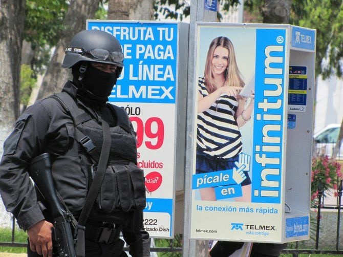 State police from Tamaulipas, Mexico patrol the main plaza in the city of San Fernando.