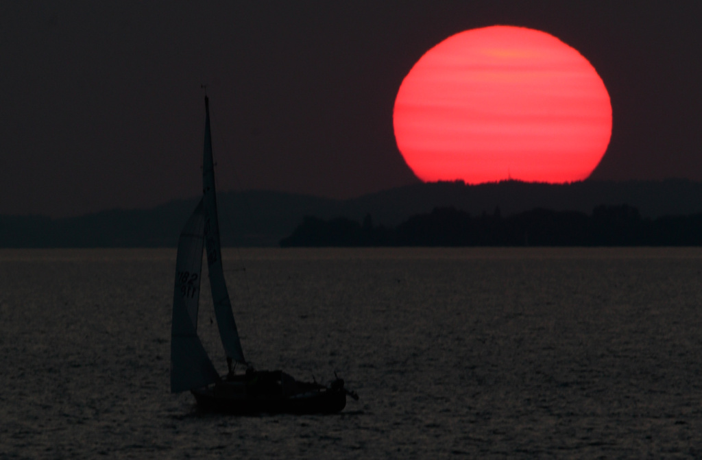 BREGENZ, AUSTRIA - JULY 12: A sunset over the Bodensee (Lake Constance) is seen ahead of the rehearsal of the opera 'Die Zauberfloete' ('The Magic Flute') of Austrian composer Wolfgang Amadeus Mozart at Seebuehne on July 12, 2013 in Bregenz, Austria. (Photo by Johannes Simon/Getty Images)