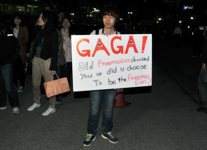A South Korean man holds a placard again