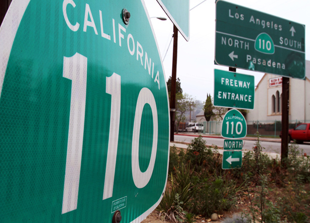 Signs direct traffic to the Pasadena (110) Freeway, Sunday, May 16, 2010, in Pasadena, Calif. Opened in 1940 to connect Pasadena and downtown Los Angeles, the winding 8-mile parkway is the nation's oldest freeway.