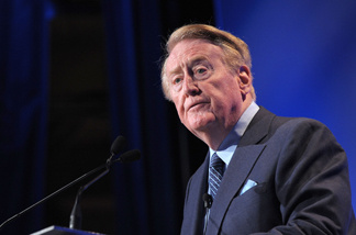Vin Scully announced that he will continue to call Dodgers' games in the 2011 season. In this photo, Scully speaks at the Hollywood Radio & Television Society Newsmaker Lunheon at the Beverly Wilshire Hotel on Nov. 10, 2009 in Beverly Hills, California.