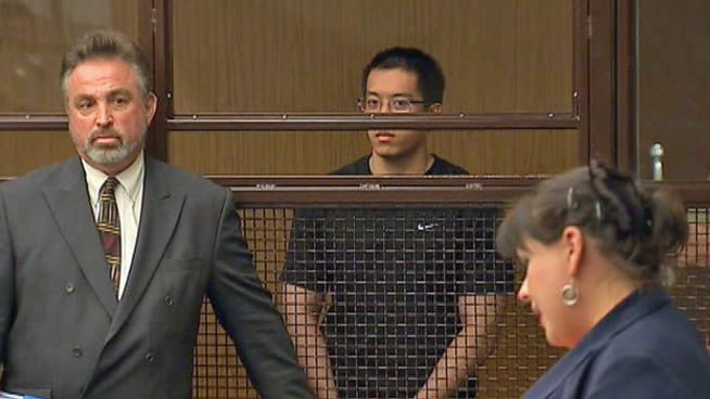 Defense attorney David M. Wallin (L) and Eric Yee (C) look on as a prosecutor (R) argues for $2 million bail on Sept. 19, 2012.