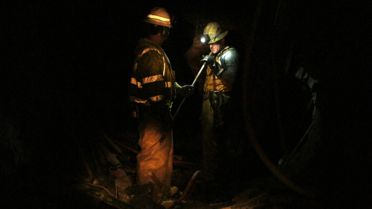 Miner Steve Ator cleans a drill bit inside the Lincoln Project Mine, in Sutter Creek, Calif.
