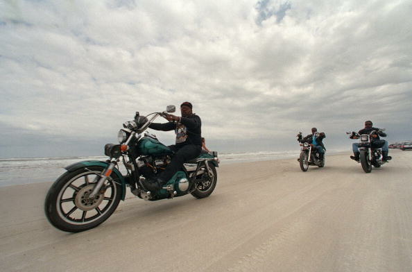 Motorcyclists, one of them on a Harley D