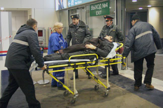 Parmedics evacuate a wounded person from Moscow's Domodedovo International Airport on Jan. 24, 2011, after an explosion killed at least 35 people.