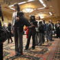 Job Seekers Look For Employment Opportunities At Career Fair