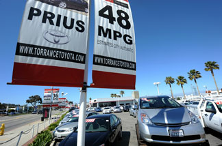 Prius (R) and other Toyota cars are on display at a Toyota dealership in Torrance, California, on March 12, 2010.