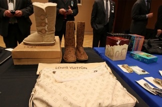Counterfeit goods are on display during the announcement of the seizure of 82 website domain names — five of which in Los Angeles — during a news conference at the Department of Justice on Nov. 29, 2010 in Washington, D.C. Attorney General Holder spoke about the seizure orders that were given towards commercial online retailers engaged in the illegal sale and distribution of counterfeit goods such as sports equipment, shoes, and handbags and copyrighted material such as music, DVDs and software as part of 'Operation: In Our Sites v.2.0'.