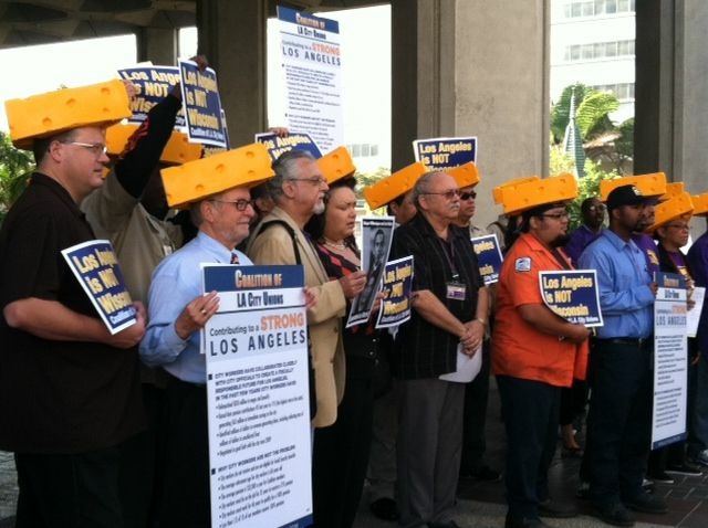 Members of the Coalition of L.A. City Unions protested the city's pension reform plan. They wore cheesehead hats as they likened Mayor Antonio Villaraigosa’s treatment of union workers to that of Wisconsin Gov. Scott Walker.