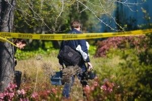 A crime scene investigator last week at Oikos University in Oakland.
