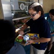 Kitty Chora, 8, gets lunch at Gratts Learning Academy for Young Scholars in Los Angeles. The Los Angeles Unified School District is starting a program that brings food produced within 200 miles of Los Angeles to area schools every Thursday.