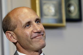 In this Oct. 30, 2007, file photo, former Orange County Sheriff Michael Carona smiles during an interview at the Orange County Sheriff's headquarters in Santa Ana, Calif.