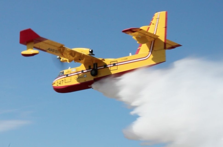Canadair Super Scooper releasing its payload in a demonstration at the Van Nuys Airport 9-4-2012.