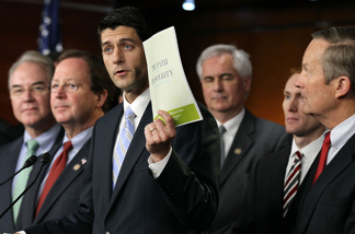 Flanked by other congressionial members, U.S. Rep. Paul Ryan (R-WI) (C), chairman of the House Budget Committee, holds up a copy of the 2012 Republican budget proposal during a news conference April 5, 2011 on Capitol Hill in Washington, DC.