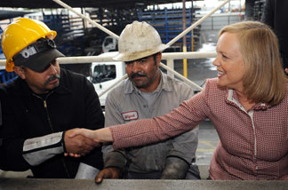 Meg Whitman, Republican nominee for governor, meets Latino employees of Ramcast Ornamental in Los Angeles, California on October 21, 2010.