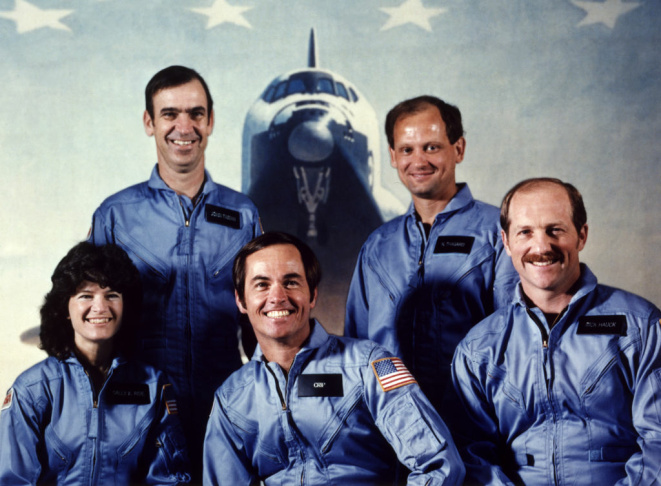 NASA astronaut Robert Crippen (C, first row), the