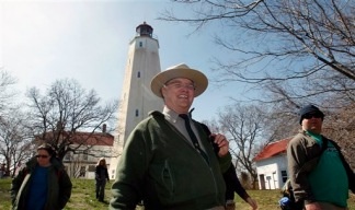 Park Ranger Dan Meharg leads a group of visitors at the Sandy Hook Lighthouse in Gateway National recreation Area Saturday, April 9, 2011. A last-minute budget deal forged with tough bargaining averted an embarrassing U.S. government shutdown, cut billions in spending and provided the first major test of the divided government that voters ushered in five months ago. Dan Meharg said that Friday he wasn't sure that he would be working Saturday.
