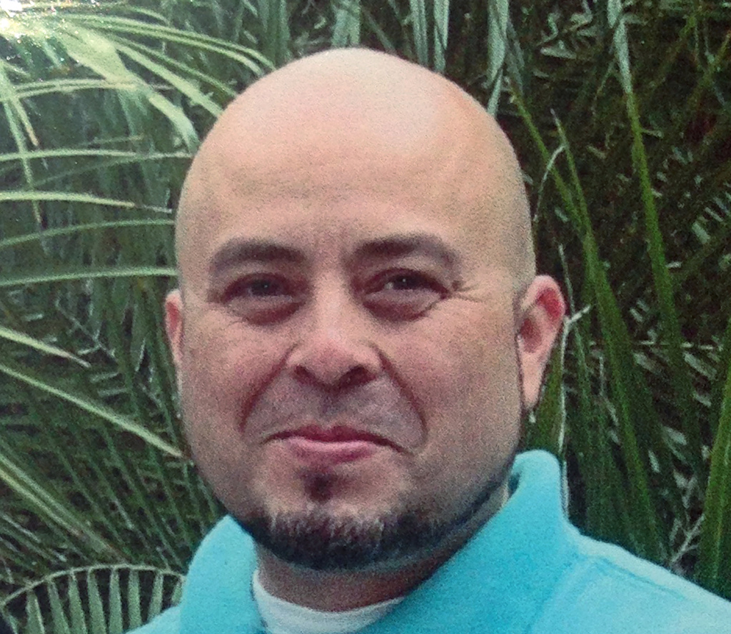 This June, 2013 photo released by the Hernandez family Saturday, Nov. 2, 2013, shows Transportation Security Administration officer Gerardo Hernandez. Hernandez, 39, was shot to death and several others wounded by a gunman who went on a shooting rampage in Terminal 3 at Los Angeles International Airport Friday.