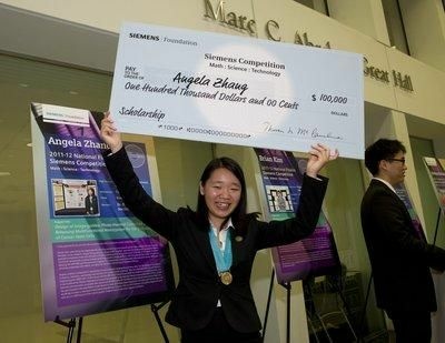 Angela Zhang, of Cupertino, holds aloft the winner's $100,000 scholarship check after being named the winner of the 2011 Siemens Competition in Math, Science and Technology. Zhang, a senior at Monta Vista High School, designed an drug delivery system which would deliver the drug salinomycin to cancer stem cells, which she says are responsible for initiating and driving tumor growth. She hopes to major in chemical or biomedical engineering or physics and ultimately become a research professor.