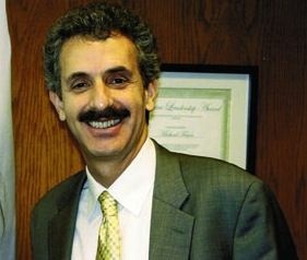 Assemblyman Mike Feuer was hospitalized Monday after his car was struck by a truck that allegedly ran a red light. His campaign consultant says he will remain in the hospital for the next few days.