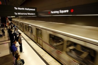 Passengers wait to board a North Hollywood-bound Red Line MTA train.