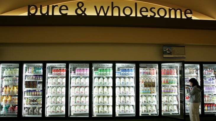 A customer shops for milk at a Safeway in Livermore, Calif. Although it may seem counterintuitive, there's growing evidence that full-fat dairy is linked to reduced body weight.