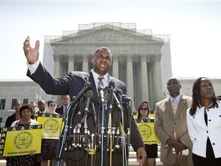 Ryan P. Haygood, director of the NAACP Legal Defense Fund, talks outside the Supreme Court on Tuesday about the court's opinion in Shelby County v. Holder.