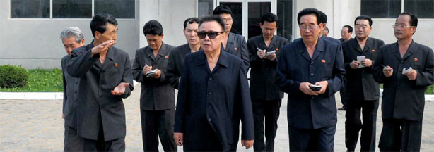 This undated picture, released from Korean Central News Agency on June 19, 2010, shows North Korean leader Kim Jong Il (in sunglasses) inspecting a factory.