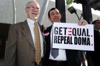 Same-sex couple Nowlin Haltom (L) and Michael McKeon (R) joined other same-sex couples who requested and were rejected for marriage licenses as part of a national "Request Marriage" action and call for the repeal of the Defense of Marriage Act (DOMA).