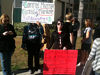 About 10 Michael Jackson fans gather outside the Los Angeles Superior Court Airport branch on Monday, Feb. 8, 2010. Jackson's doctor, Conrad Murray, was charged with one count of involuntary manslaughter in connection with the pop star's death.