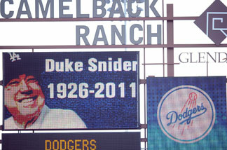 A picture of Duke Snider is displayed on the stadium scoreboard in honor of his life during the game bewteeen the Los Angeles Angels and the Los Angeles Dodgers during spring training at Camelback Ranch on February 27, 2011 in Phoenix, Arizona.