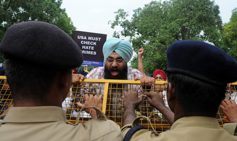Activists of the Shiromani Akali Dal shout anti-US slogans during a protest near the U.S. embassy in New Delhi on Monday, August 6, 2012.