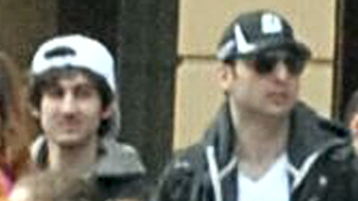 Soon after authorities distributed this image of Dzhokhar (at left) and Tamerlan Tsarnaev near the finish line of the Boston Marathon just before bombs exploded there, the brothers allegedly killed an MIT police officer, carjacked a vehicle and engaged in