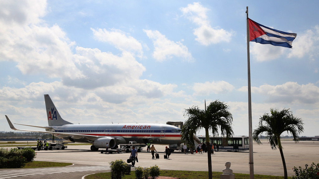 Passengers walk across the tarmac at Jose Marti International Airport after arriving on a charter plane operated by American Airlines January 19, 2015, in Havana, Cuba. The Department of Transportation has approved scheduled flights from the U.S. to Cuba, Passengers walk across the tarmac at Jose Marti International Airport after arriving on a charter plane operated by American Airlines January 19, 2015, in Havana, Cuba. The Department of Transportation has approved scheduled flights from the U.S. to Cuba, including some operated by American — though no flights to Havana have yet been authorized.