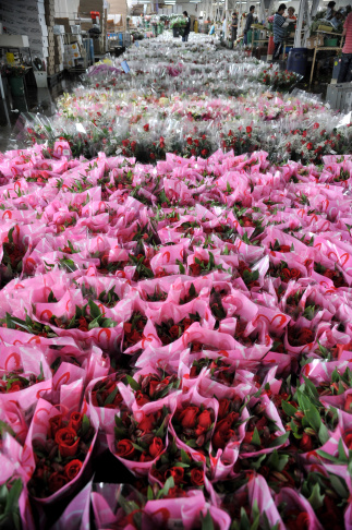 View of packed bouquets of roses ahead o