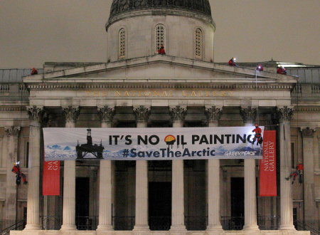 Greenpeace protesters scale the pillars