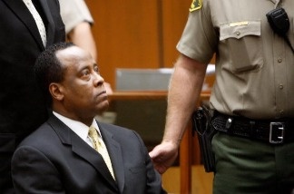 Dr. Conrad Murray sits near the bailiff as he appears at Los Angeles Superior Court on April 5, 2010 in Los Angeles, California.