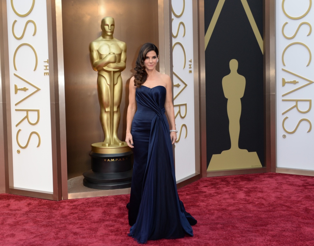 Nominee for Best Actress in 'Gravity' Sandra Bullock arrives on the red carpet for the 86th Academy Awards on March 2nd, 2014 in Hollywood.