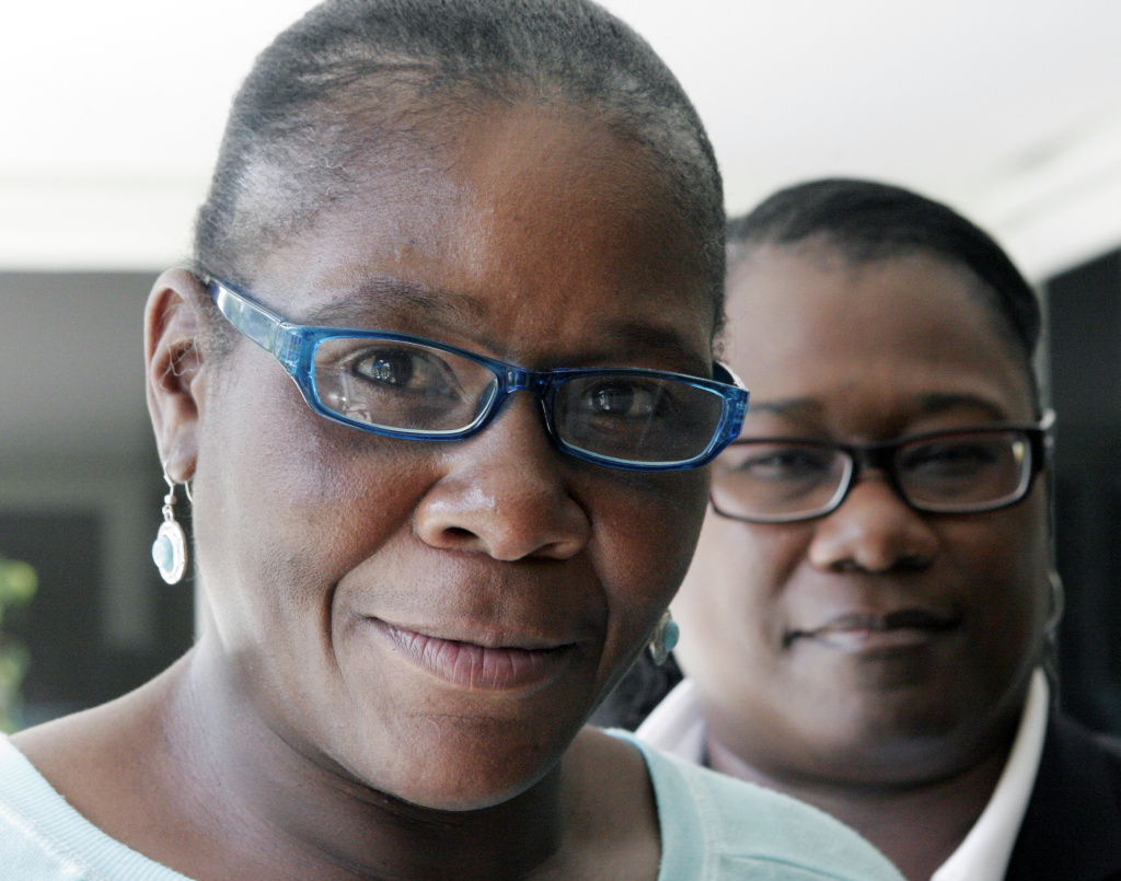 Marlene Pinnock, left, poses with her attorney, Caree Harper during an interview Sunday Aug. 10, 2014 in Los Angeles. Pinnock, a homeless woman, was beaten by a CHP officer in July 2014. Sunday was Pinnock's first publicized interview since the incident, which was videotaped.