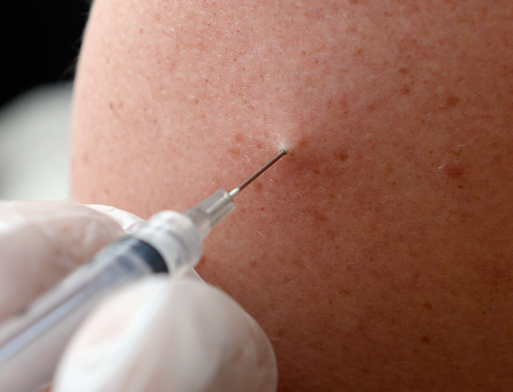 People receive a free meningitis vaccine from Dr. Wayne Chen at the AIDS Healthcare Foundation pharmacy on April 15, 2013 in Hollywood, California. Health officials say eight people in Los Angeles County have been diagnosed with bacterial meningitis so far in 2014.