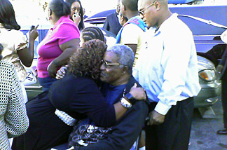 Family members of 5 year-old Aaron Shannon Jr. comfort each other after funeral services at City of Refuge church in Gardena.