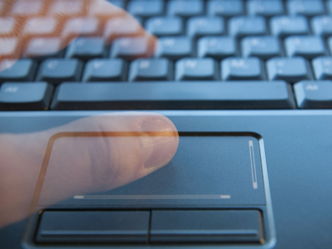 Ghostly fingers on a computer keyboard.
