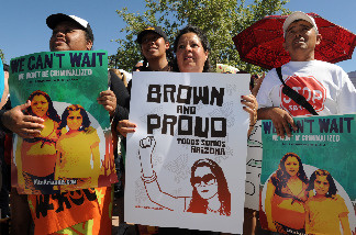 Protesters demonstrate against Arizona's new immigration laws at a rally in Phoenix on May 29, 2010.
