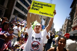 Immigration reform supporters march during a May Day protest May 1, 2011, in downtown Los Angeles. A comprehensive reform bill passed in the Senate last month, but it's hit resistance this week in the Republican-controlled House of Representatives.