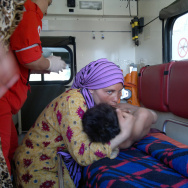 A woman embraces an injured Syrian boy i