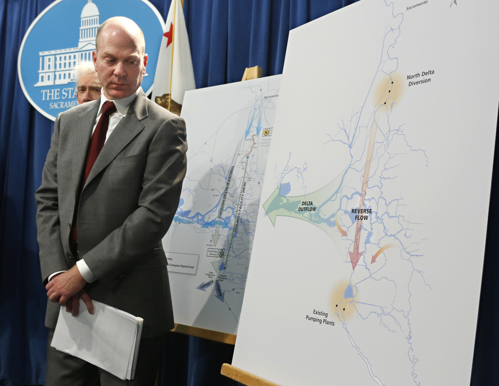 Chuck Bonham, of California's Department of Fish and Wildlife Services, glances at a diagram showing the water flow into and out of the Sacramento-San Joaquin Delta.