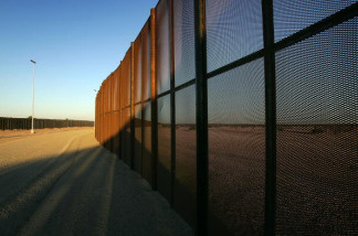 A metal fence constructed by National Guardsmen along the U.S.-Mexico border east of San Luis, Arizona, October 2007. The border amendment to the Senate immigration bill, which cleared a test vote Monday, proposes doubling the existing amount of border fence and U.S. Border Patrol agents.