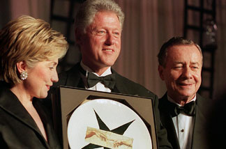 File photo: US President Bill Clinton (C), First Lady Hillary Rodham Clinton (L) and National Italian American Foundation President Joseph Cerrell (R) are pictured at the NAIF Gala Dinner 16 October 1999 in Washington, DC.